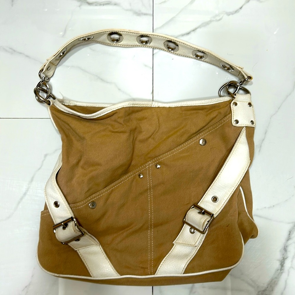 Nine West sized khaki shoulder handbag with white leather strap.